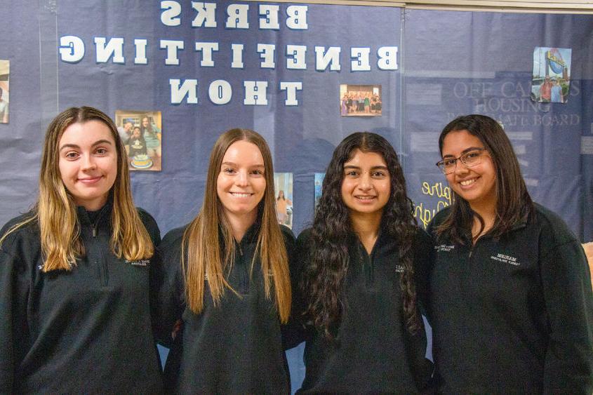 Four female Berks students smile for the camera